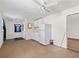 Small kitchenette with white cabinets and refrigerator at 703 & 705 Cleveland Ave, Wildwood, FL 34785