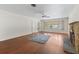 Spacious living room with hardwood floors, fireplace and large window at 703 & 705 Cleveland Ave, Wildwood, FL 34785