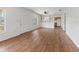 Open living and dining area with wood-look floors at 703 & 705 Cleveland Ave, Wildwood, FL 34785