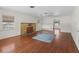 Living room with hardwood floors and fireplace at 703 & 705 Cleveland Ave, Wildwood, FL 34785