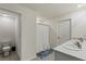 Clean bathroom with double vanity and shower at 8511 Triumph Cir, Wildwood, FL 34785