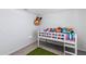 bedroom with built-in bed and toy storage at 8511 Triumph Cir, Wildwood, FL 34785