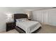 Spacious bedroom with plush carpet and a comfortable bed at 8511 Triumph Cir, Wildwood, FL 34785