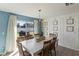 Bright dining room features a table with chairs and access to the backyard at 8511 Triumph Cir, Wildwood, FL 34785
