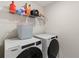 Laundry room with Whirlpool washer and dryer at 8511 Triumph Cir, Wildwood, FL 34785