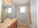 Bathroom with double vanity, shower/tub combo, and tile floor at 904 Cloverwood Way, Winter Garden, FL 34787