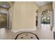 Open foyer with views to living room and pool at 9339 San Jose Blvd, Howey In The Hills, FL 34737