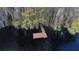 Aerial view of a wooden dock on a lake at 9622 Dr Baker Rd, Groveland, FL 34736
