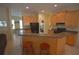 Spacious kitchen with island, breakfast nook and ample cabinets at 9622 Dr Baker Rd, Groveland, FL 34736