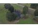Aerial view of a pond with a small dock at 9622 Dr Baker Rd, Groveland, FL 34736
