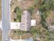 Aerial home view showing house, yard, and shed at 100 E Golf Links Ave, Eustis, FL 32726