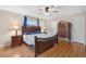 Spacious bedroom with wood flooring and a large dresser at 10662 Se 174Th Loop, Summerfield, FL 34491