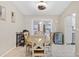 Bright dining area with round table and four chairs, near the kitchen at 10662 Se 174Th Loop, Summerfield, FL 34491