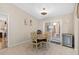 Casual dining area with a round wooden table and sliding glass doors at 10662 Se 174Th Loop, Summerfield, FL 34491
