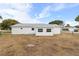 White single story house with large backyard and Florida sun at 10662 Se 174Th Loop, Summerfield, FL 34491