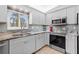 Updated kitchen with granite countertops and stainless steel appliances at 10662 Se 174Th Loop, Summerfield, FL 34491