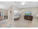 Open concept living room with a view of the kitchen and dining area at 10662 Se 174Th Loop, Summerfield, FL 34491