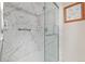 Updated shower with marble walls and glass enclosure at 10662 Se 174Th Loop, Summerfield, FL 34491