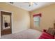 Bedroom with a red couch and access to another room at 1070 Bentry Ct, Clermont, FL 34711