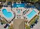 Resort-style pool area with multiple pools, spa, lounge chairs, and ample parking at 11631 Sw 82Nd Ter, Ocala, FL 34481