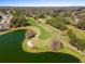 Aerial view of golf course with lake and residential homes at 11631 Sw 82Nd Ter, Ocala, FL 34481