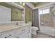 Clean bathroom with single vanity, toilet and tub at 11631 Sw 82Nd Ter, Ocala, FL 34481