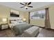 Bedroom with ceiling fan and large window allowing for natural light at 11631 Sw 82Nd Ter, Ocala, FL 34481