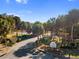 Island club entrance, palm trees line driveway at 11631 Sw 82Nd Ter, Ocala, FL 34481