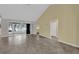 Bright living room with tile flooring, a sunroom, and an open floor plan at 11631 Sw 82Nd Ter, Ocala, FL 34481