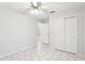 Bedroom with tile floor, double doors, and ceiling fan at 1330 Lajolla Cir, The Villages, FL 32159