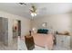 Bedroom with ensuite bath and ceiling fan at 1330 Lajolla Cir, The Villages, FL 32159