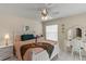 Bright bedroom with a queen-size bed and ensuite vanity at 1330 Lajolla Cir, The Villages, FL 32159