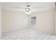 Bright bedroom with tile flooring and ceiling fan at 1330 Lajolla Cir, The Villages, FL 32159