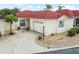 Charming single-story home featuring a red roof, well-maintained landscaping, and an attached garage at 1330 Lajolla Cir, The Villages, FL 32159