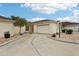 Exterior view of a light yellow house with a garage and landscaping at 1330 Lajolla Cir, The Villages, FL 32159