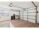 Garage with storage shelves and workbench at 1330 Lajolla Cir, The Villages, FL 32159