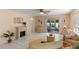 Cozy living room with fireplace and access to the outdoors at 1330 Lajolla Cir, The Villages, FL 32159