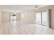 Spacious living area with tile floors and access to a patio at 1330 Lajolla Cir, The Villages, FL 32159