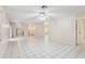 Bright living room with tile floors and ceiling fans at 1330 Lajolla Cir, The Villages, FL 32159