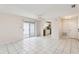 Bright living room with tile floors and sliding glass doors leading to a patio at 1330 Lajolla Cir, The Villages, FL 32159