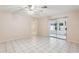 Bright living room featuring tile floors and sliding glass doors at 1330 Lajolla Cir, The Villages, FL 32159