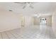 Spacious living room with tile flooring and ceiling fans at 1330 Lajolla Cir, The Villages, FL 32159
