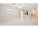 Open concept living room with tile floors and access to kitchen at 1330 Lajolla Cir, The Villages, FL 32159