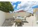 Relaxing patio with a small table and chairs for outdoor dining at 1330 Lajolla Cir, The Villages, FL 32159