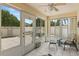Bright sunroom with seating area and access to the patio at 1330 Lajolla Cir, The Villages, FL 32159