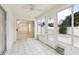 Bright sunroom with tile floors and sliding glass doors leading to backyard at 1330 Lajolla Cir, The Villages, FL 32159