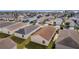 Aerial view of a house with a brown roof and its surroundings at 1387 Zest Ave, The Villages, FL 32163