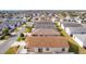 Aerial view of house and surrounding neighborhood at 1387 Zest Ave, The Villages, FL 32163
