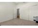 Spacious bedroom with double doors and ample closet space at 1387 Zest Ave, The Villages, FL 32163