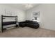 Bright bedroom with a comfy couch and built-in desk at 1387 Zest Ave, The Villages, FL 32163